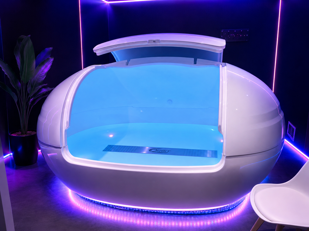 Orbit/Exo floatation pod glowing in the private suite at Yorkshire Floatation Centre
